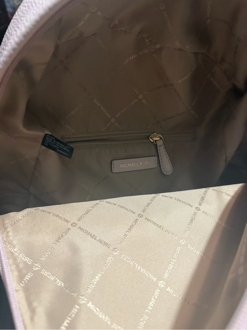 Michael Kors Mini Pebbled Leather Backpack in Pale Pink with Gold Chain